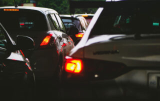 close up of tail lights of cars sitting in traffic