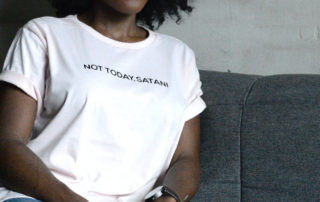 woman wearing a shirt that says not today satan